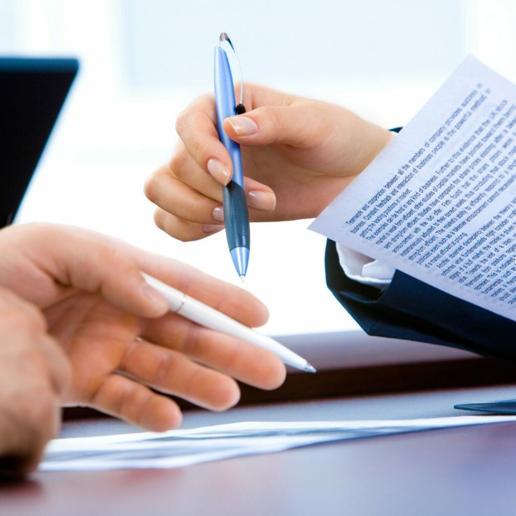 person signing a contract 